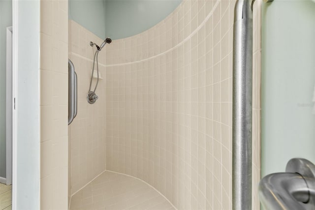 bathroom with tiled shower