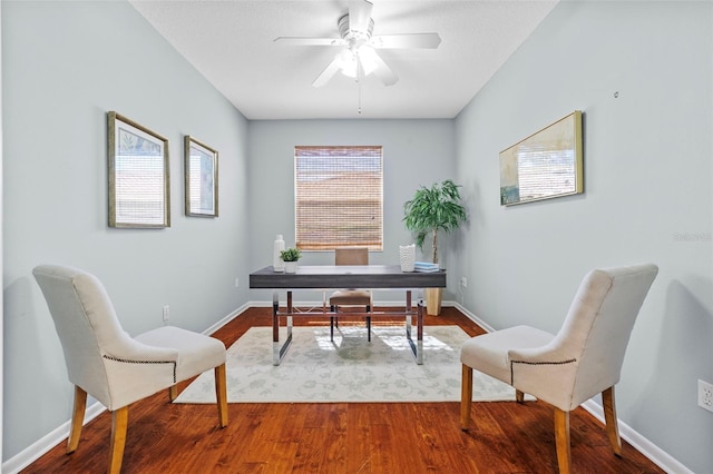 office area featuring wood finished floors, baseboards, and ceiling fan