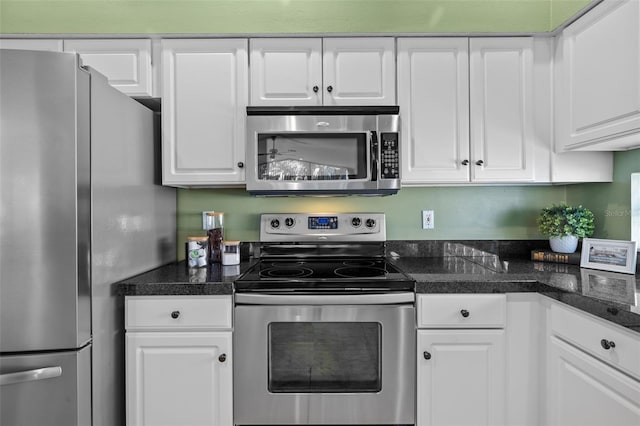 kitchen featuring white cabinets and appliances with stainless steel finishes