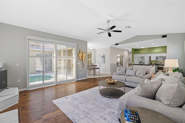 living area with visible vents, dark wood-type flooring, baseboards, lofted ceiling, and a ceiling fan