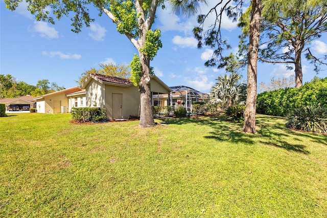 view of yard featuring a lanai