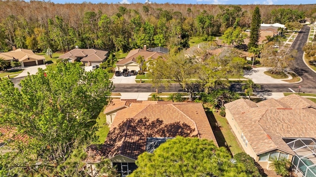 bird's eye view with a forest view and a residential view