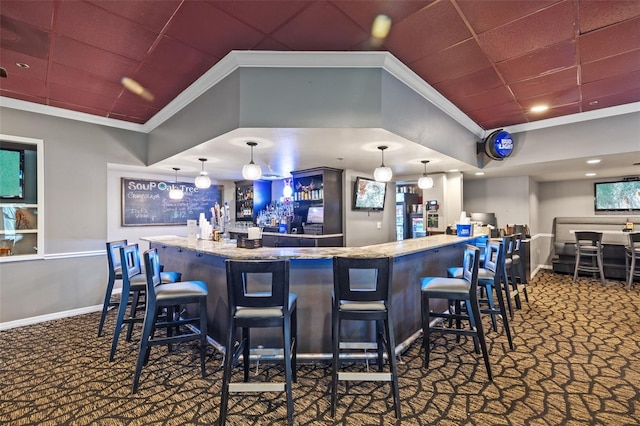 bar with baseboards, carpet floors, bar area, and ornamental molding