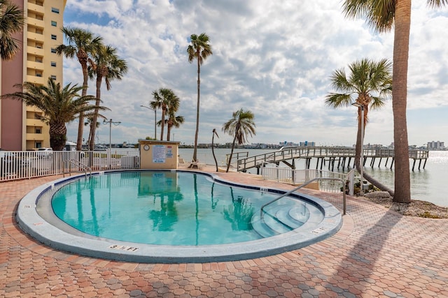 view of pool with a water view