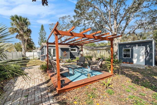 exterior space with a shed, a deck, and a pergola