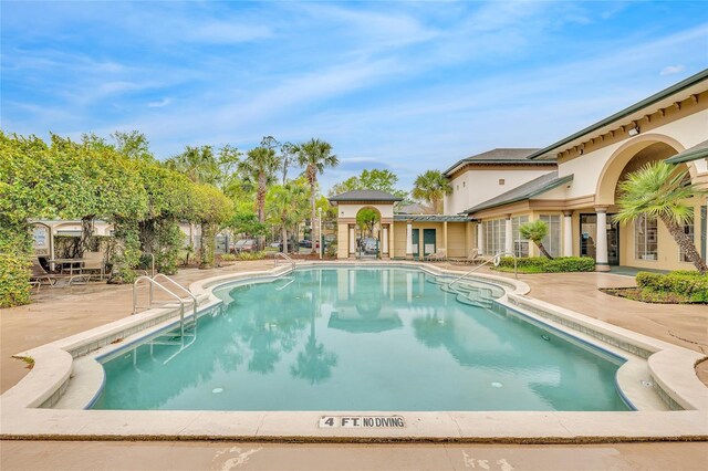 pool with a patio