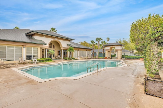 view of pool with a fenced in pool, a patio, and fence