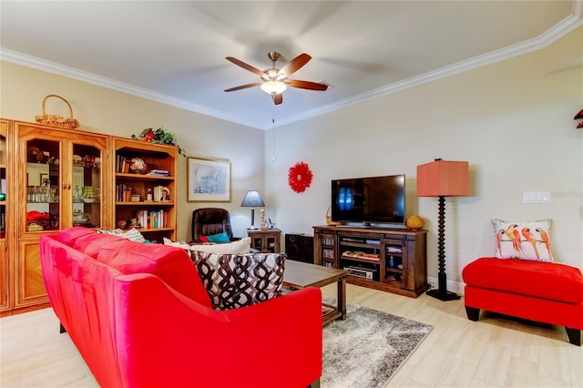 living room with light wood-type flooring, a ceiling fan, and crown molding