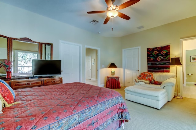 bedroom featuring ceiling fan, visible vents, baseboards, and light colored carpet