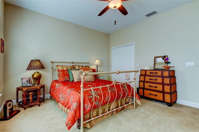 bedroom with carpet floors, a ceiling fan, visible vents, and baseboards