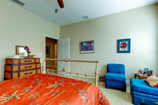 bedroom featuring baseboards, a ceiling fan, visible vents, and light colored carpet