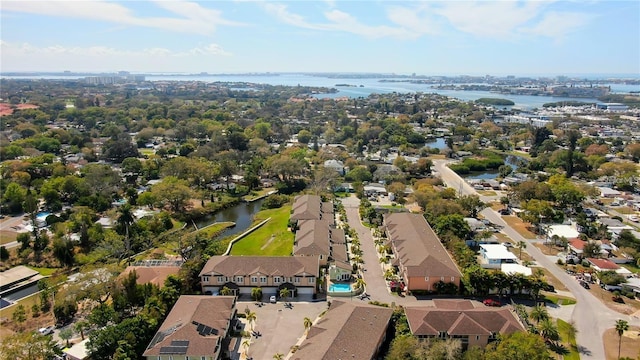 drone / aerial view featuring a water view and a residential view