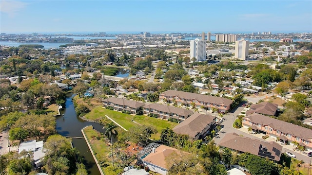 drone / aerial view featuring a water view and a residential view