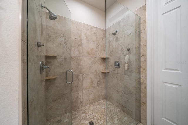 bathroom with a shower stall