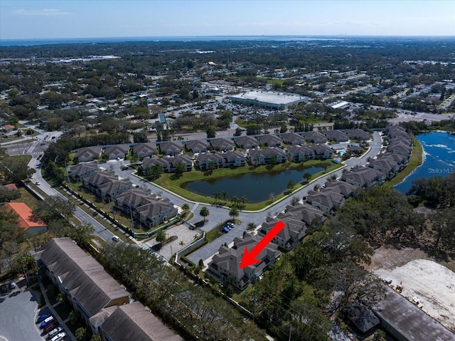 birds eye view of property featuring a residential view and a water view