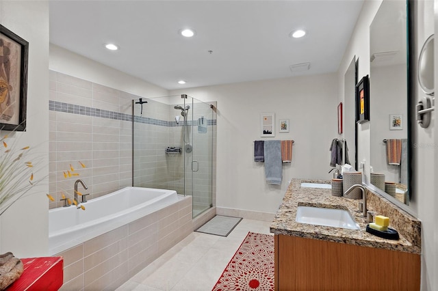 full bath with a stall shower, a garden tub, a sink, and tile patterned floors