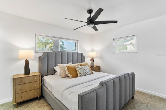 bedroom featuring baseboards and ceiling fan