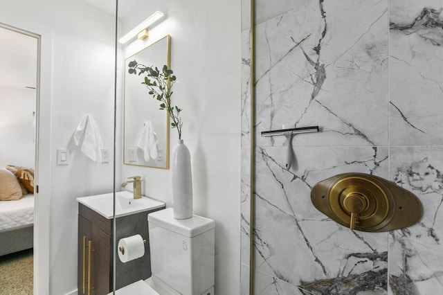 full bath featuring a marble finish shower, toilet, ensuite bath, and vanity