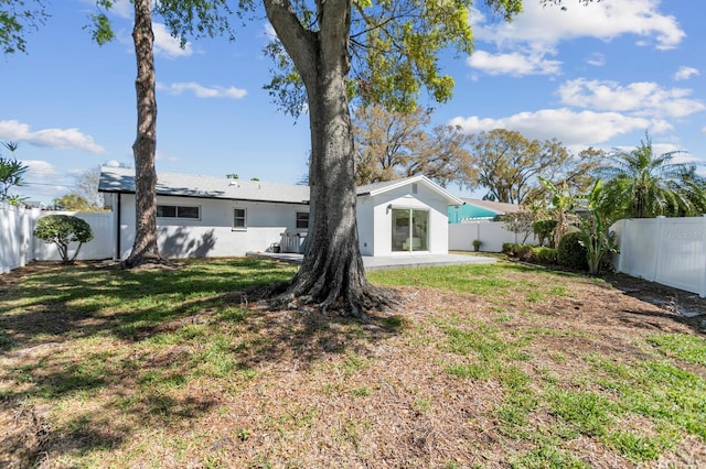 view of yard featuring a patio area and a fenced backyard