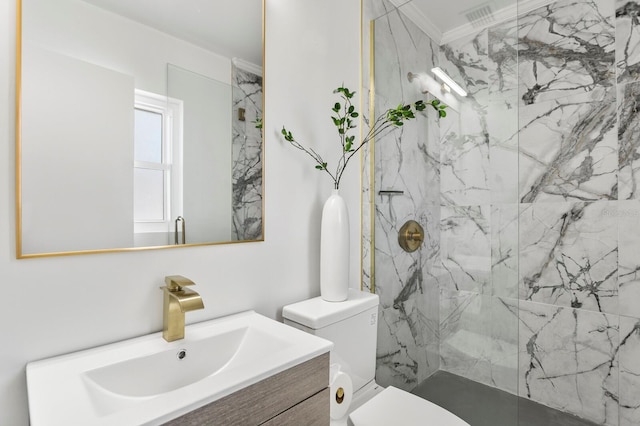 full bath with vanity, visible vents, a marble finish shower, ornamental molding, and toilet