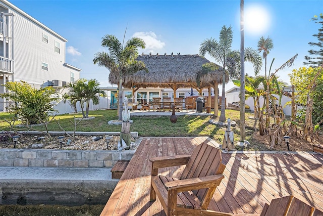 view of dock featuring a gazebo and a lawn