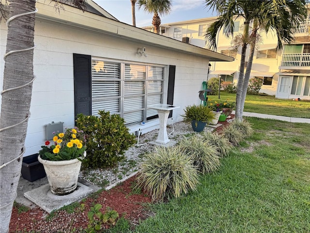 entrance to property featuring a yard