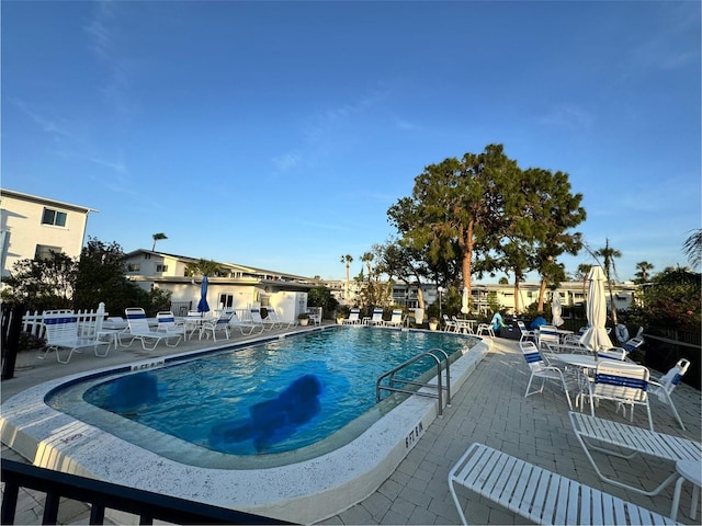 view of swimming pool with a patio