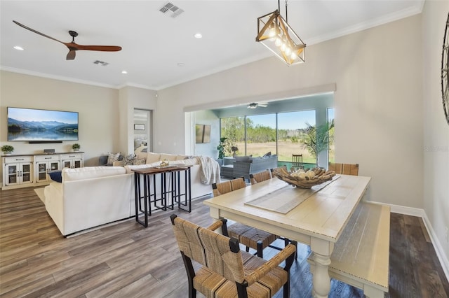 dining area featuring wood finished floors, visible vents, and ceiling fan