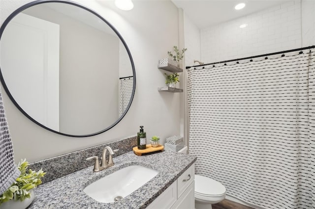 bathroom with recessed lighting, toilet, vanity, and a shower with curtain