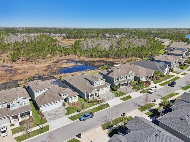 aerial view with a residential view and a water view