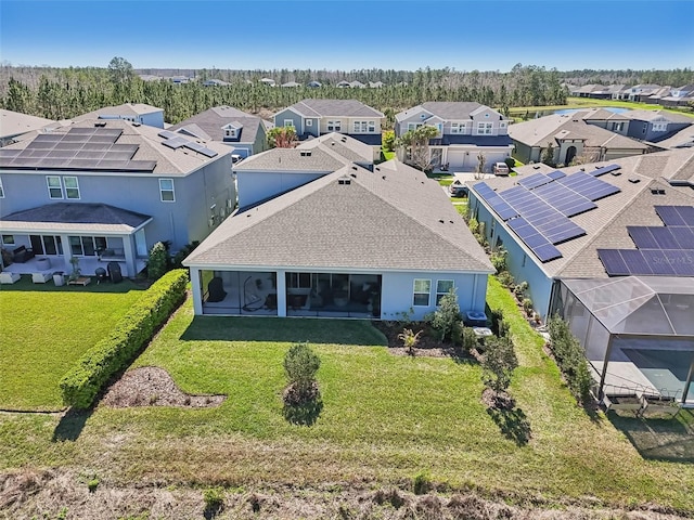 birds eye view of property with a residential view