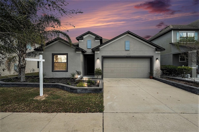 view of front of property with a garage