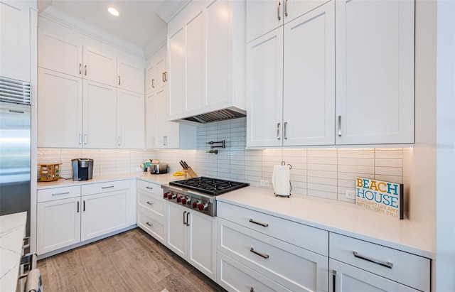 kitchen featuring light hardwood / wood-style flooring, stainless steel appliances, and white cabinetry