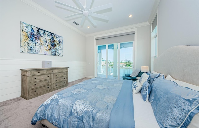 carpeted bedroom featuring ceiling fan, access to outside, and crown molding