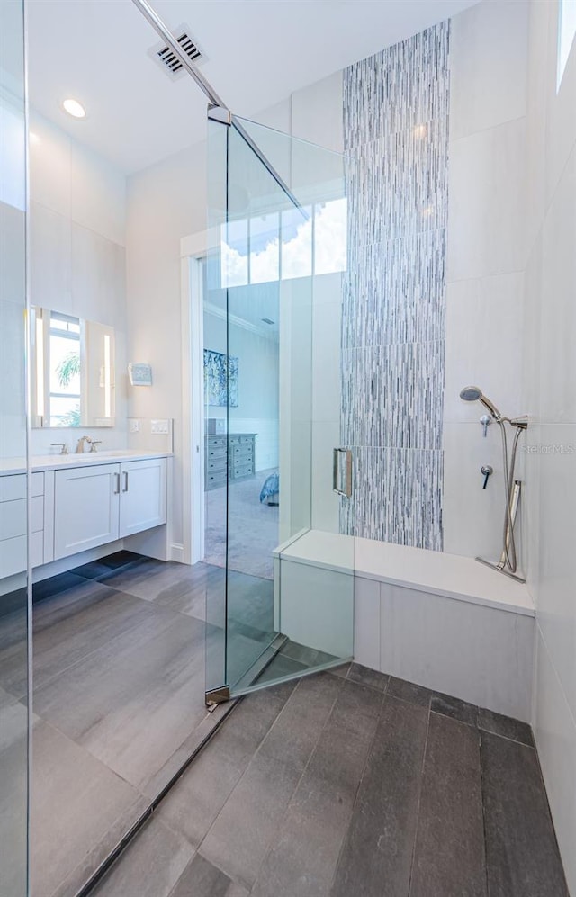 bathroom featuring vanity and walk in shower