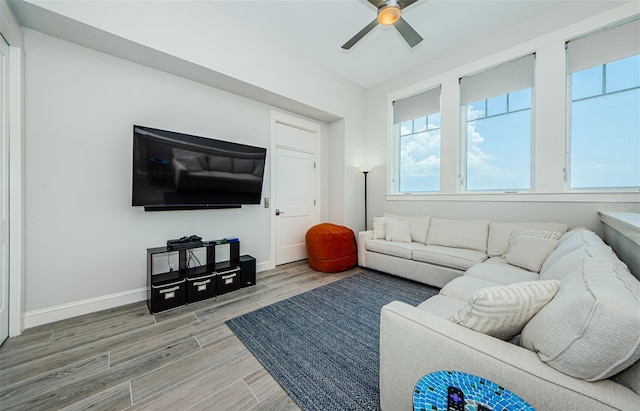 living room with hardwood / wood-style floors and ceiling fan