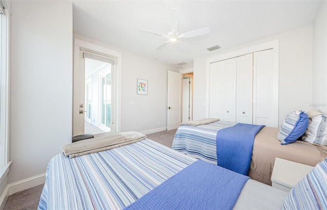 bedroom with a closet, light colored carpet, and ceiling fan