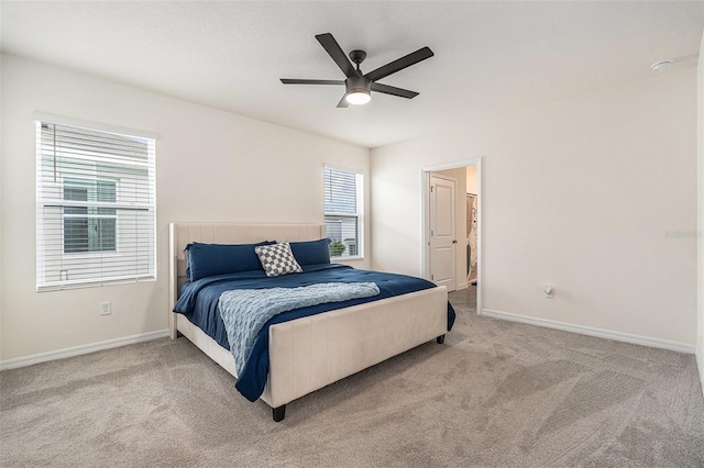 bedroom featuring carpet floors, a ceiling fan, and baseboards