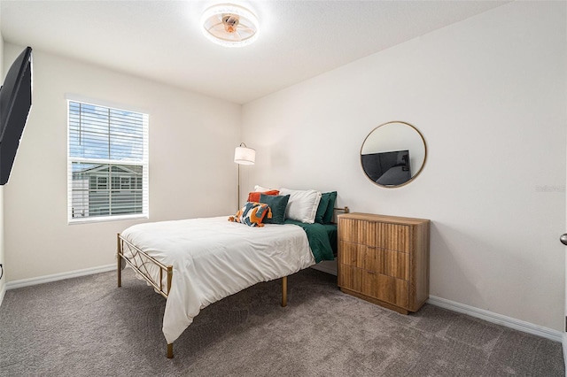 carpeted bedroom featuring baseboards