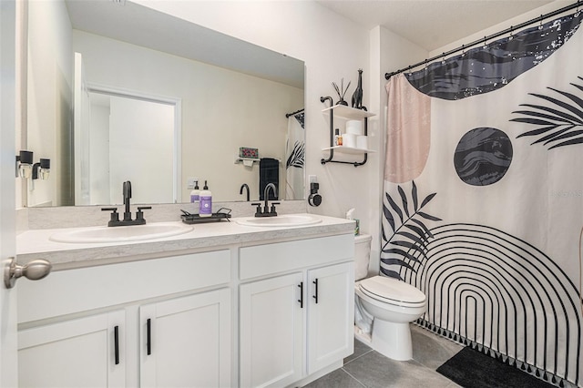 full bathroom featuring tile patterned flooring, a sink, toilet, and double vanity