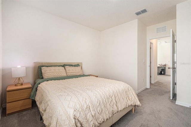 carpeted bedroom featuring visible vents and baseboards