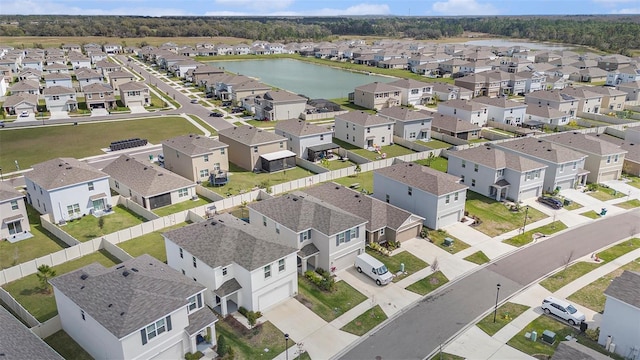 birds eye view of property featuring a residential view and a water view