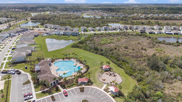 bird's eye view with a residential view and a water view