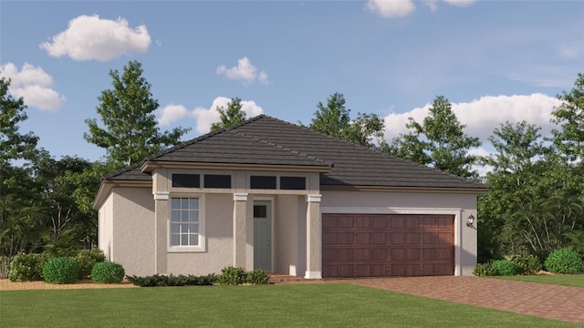 view of front of home with a garage and a front yard