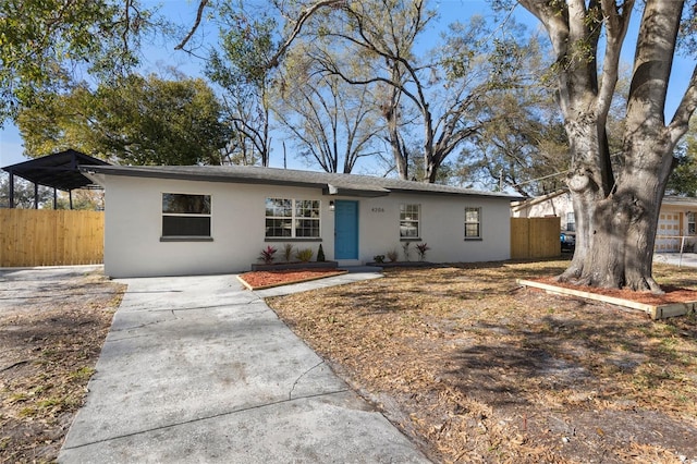 ranch-style house with a carport