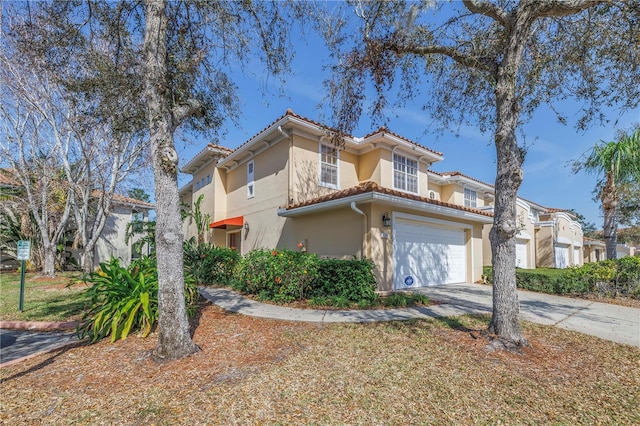 mediterranean / spanish-style house featuring a garage