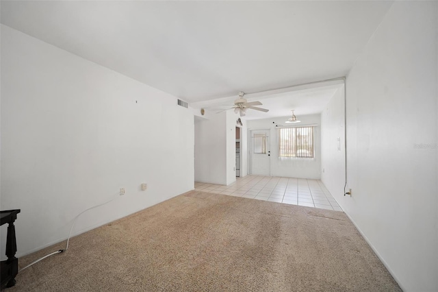 2113 Canal Dr Unit B2, Bradenton, FL 34207 - unfurnished room featuring carpet flooring, ceiling fan, and tile patterned flooring
