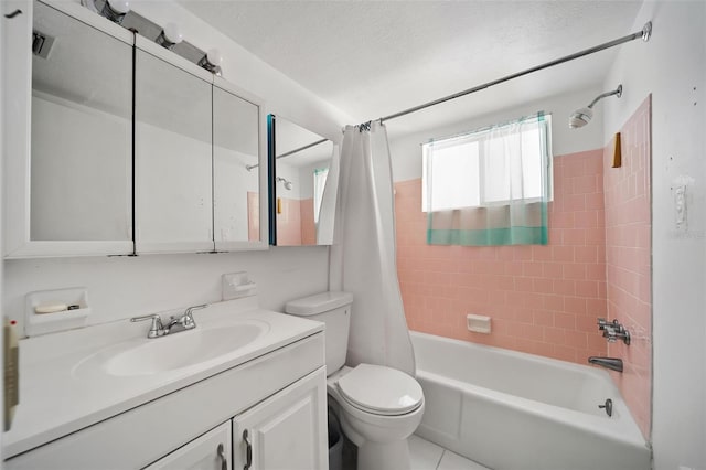 2113 Canal Dr Unit B2, Bradenton, FL 34207 - bathroom with vanity, shower / tub combo with curtain, and a textured ceiling