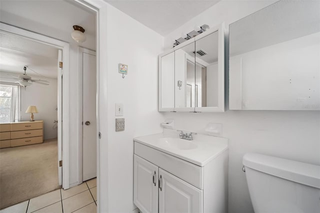 2113 Canal Dr Unit B2, Bradenton, FL 34207 - bathroom with vanity, ceiling fan, and tile patterned flooring