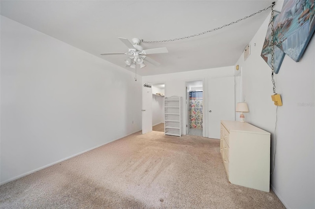 2113 Canal Dr Unit B2, Bradenton, FL 34207 - bedroom featuring carpet, a walk in closet, ceiling fan, and a closet